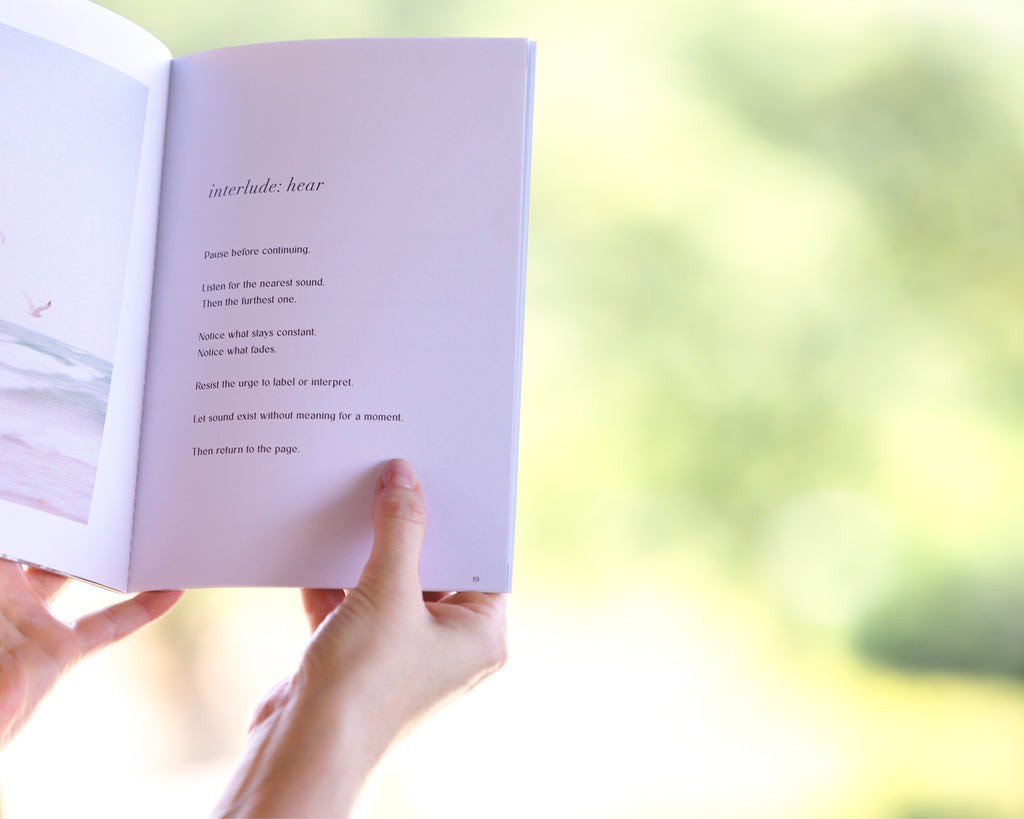 The Off Hours 48-Hour Return book held open outdoors on an interlude hear page