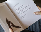 The Off Hours 48-Hour Return book held open outdoors on an interlude hear page