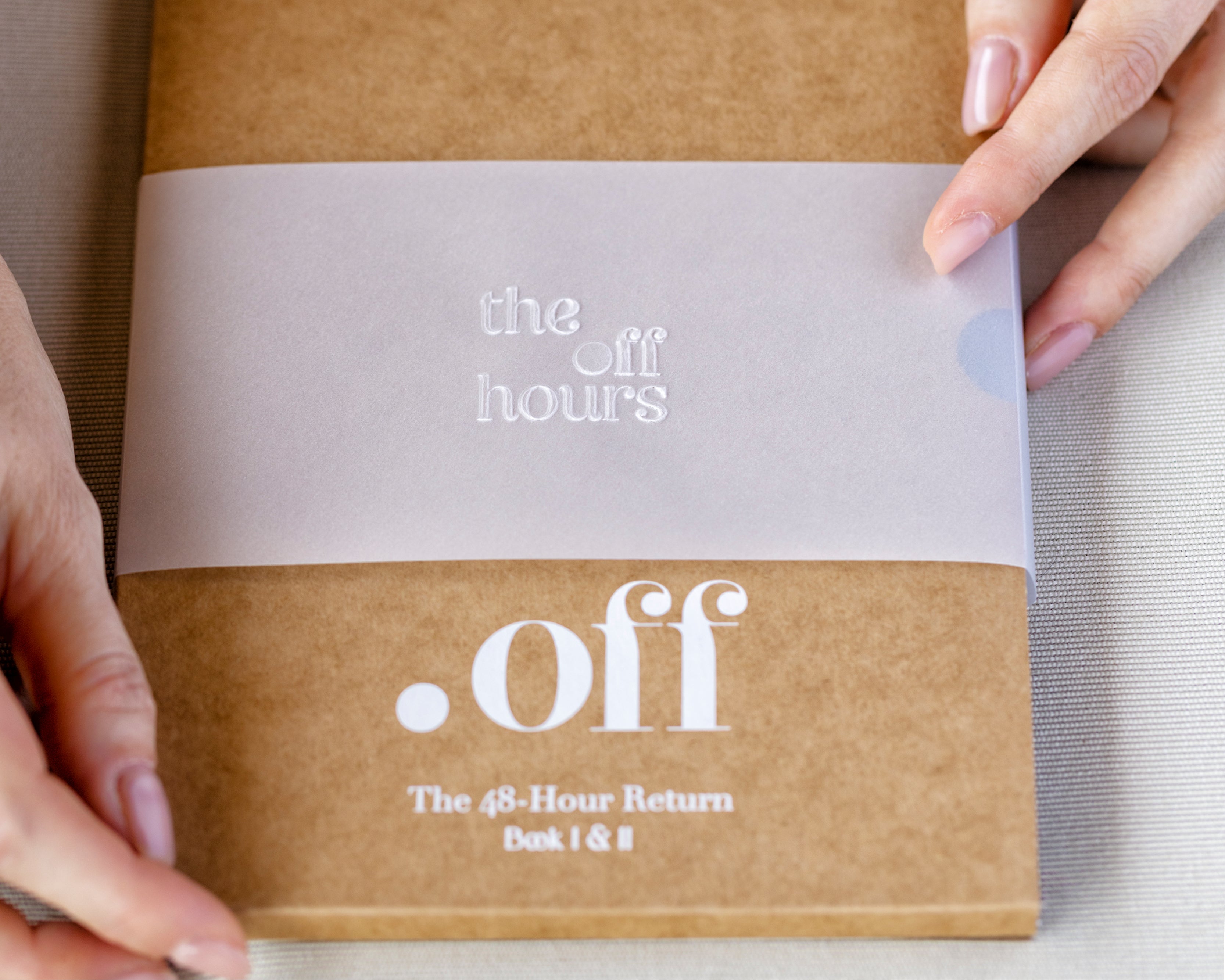 Detail of The Off Hours 48-Hour Return packaging with translucent belly band and kraft slipcase