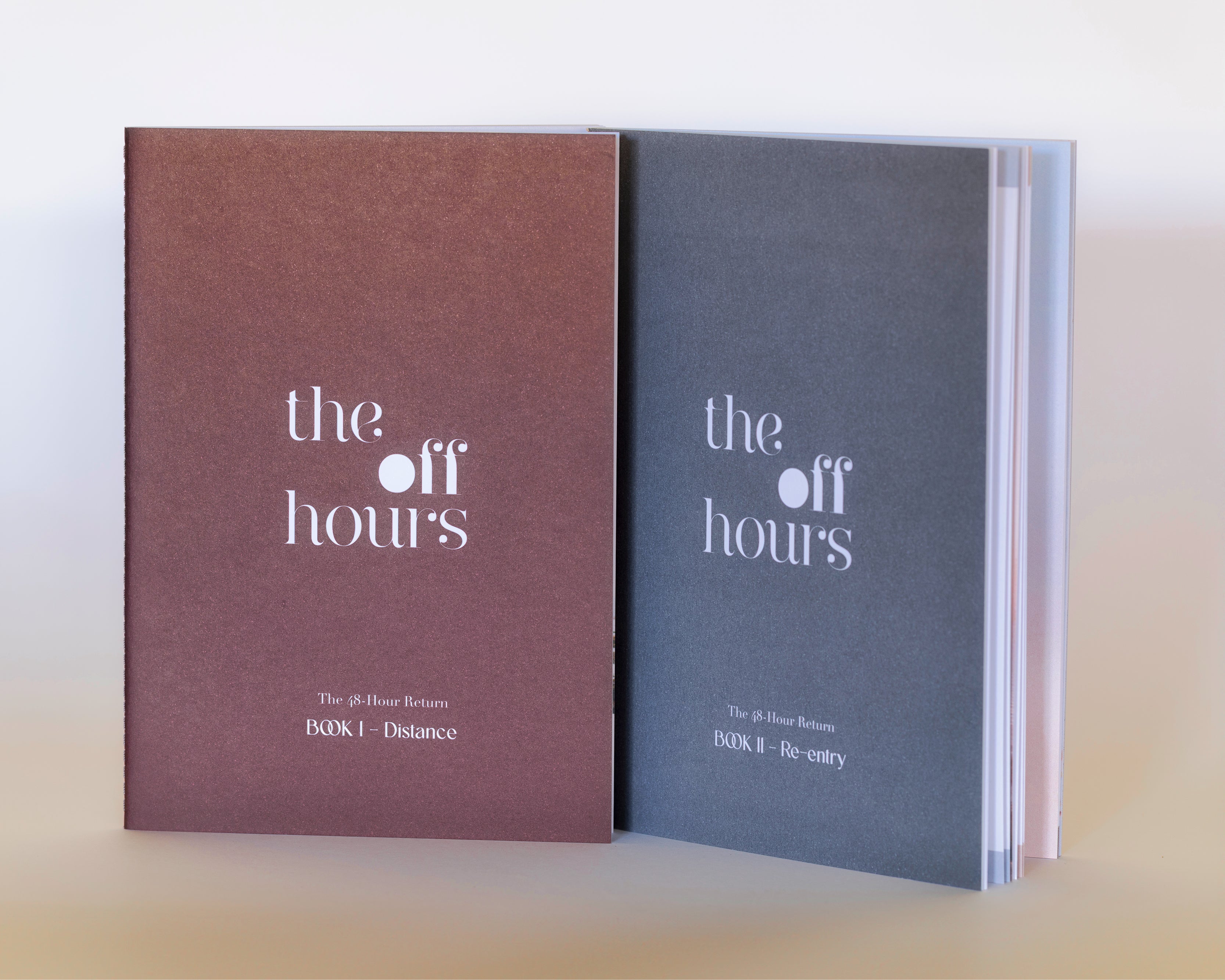 The Off Hours 48-Hour Return Book I and Book II standing upright with textured covers