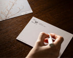 Writing on a branded postcard from The OFF Hours printed reflection set