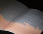 Interior spread from The 48-Hour Return with atmospheric cloud photography
